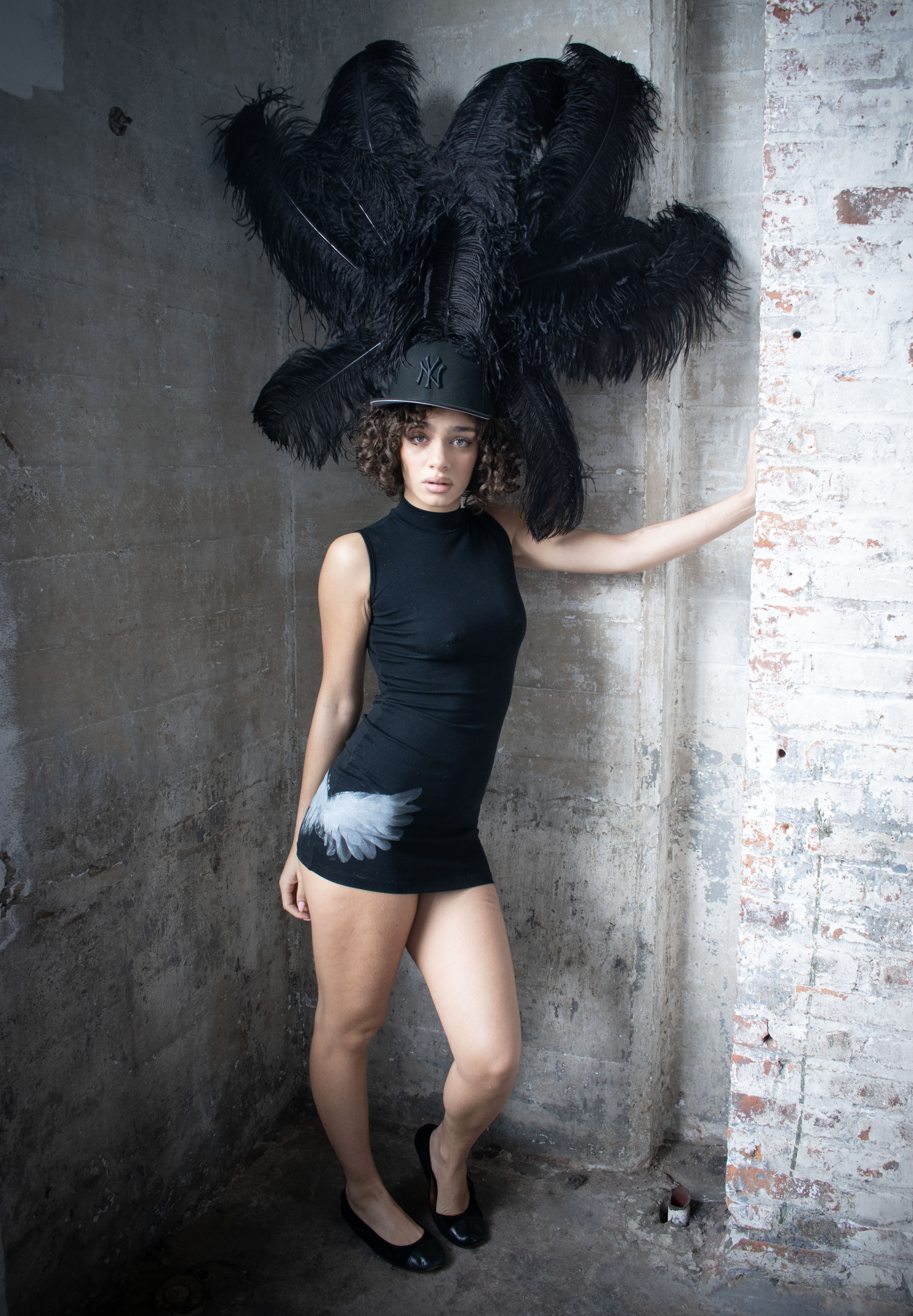 Liberty wearing a Black DANTE X Feather Hat