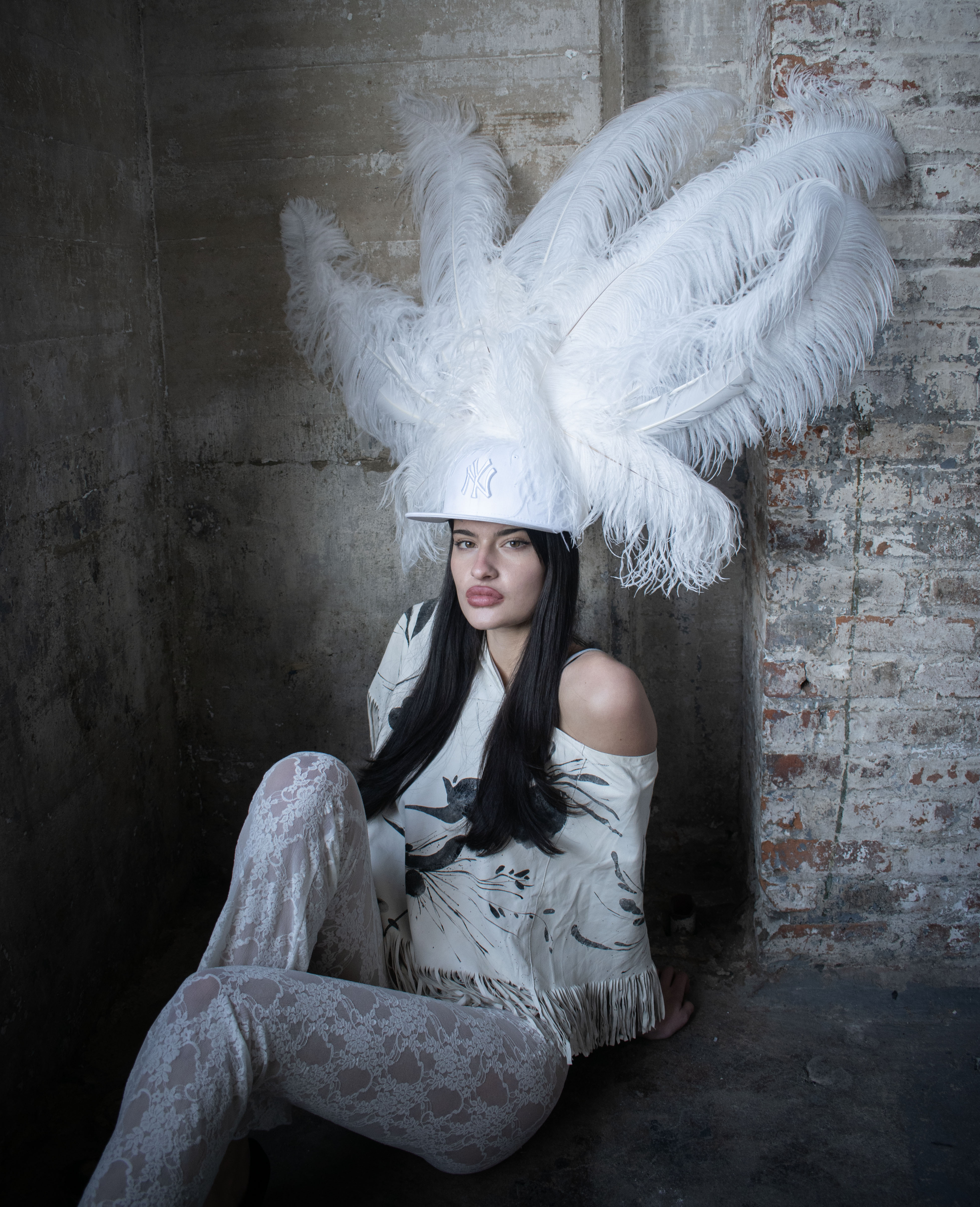 Lane wearing the White DANTE-X Ostritch Hat